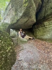 A man laying on rocks at the ledges 