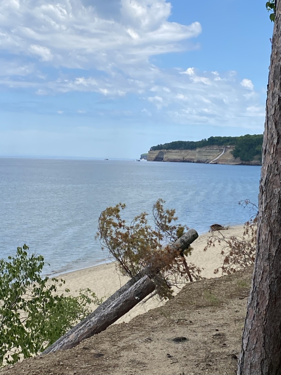 Pictured Rocks National Lake Shore, Bridal Veil Falls in the Distance, Clear Blue Sky, Lake Superior appearing unmoving ,