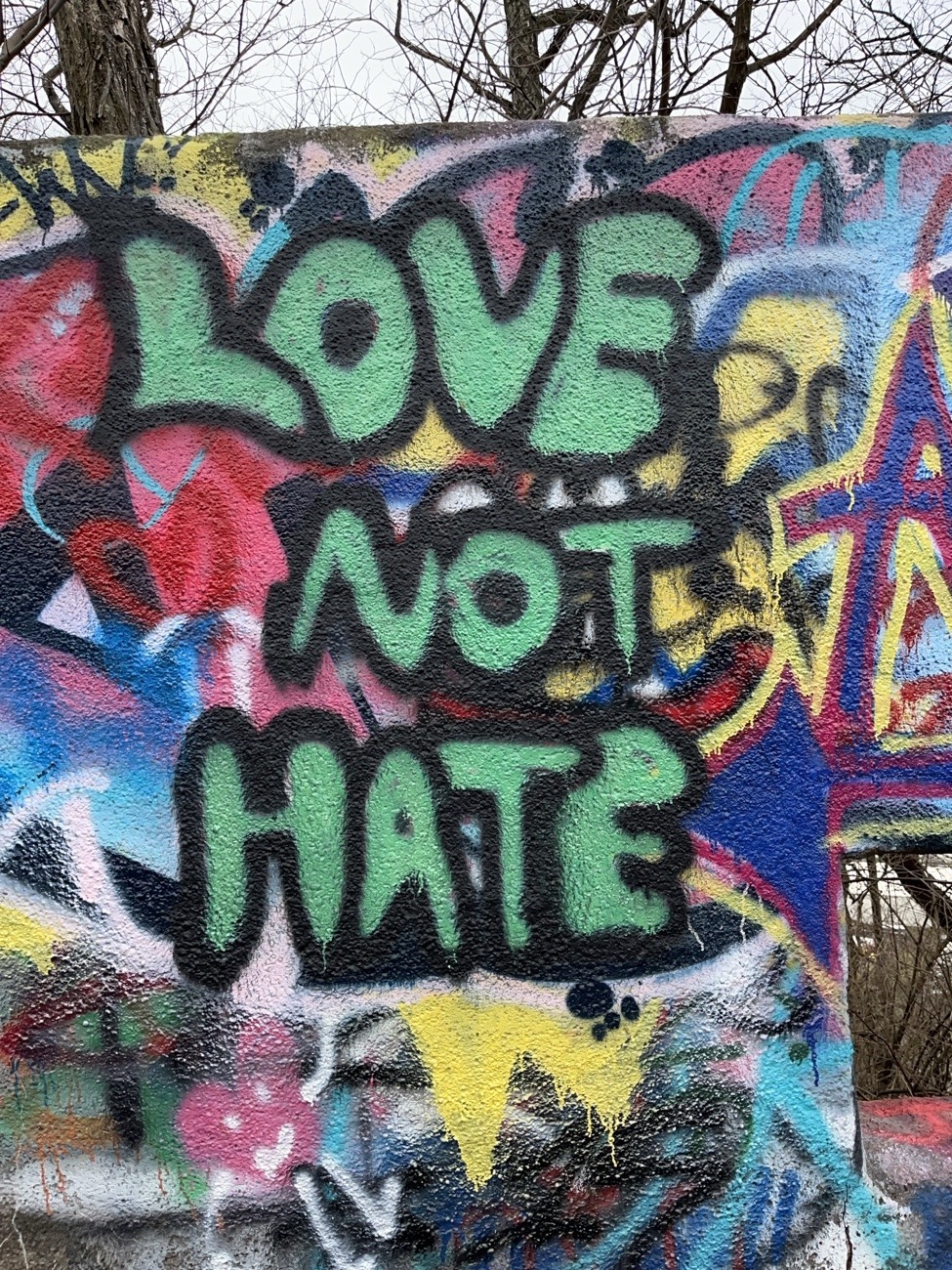 Green bubble letter Love not Hate graffiti at Mount Wood Overlook Castle in Wheeling, WV 1/7/2026