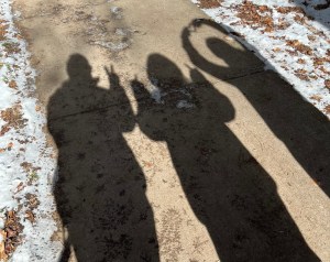 Axton, Kelsey, And Kylie's Shadow's Photographed Axton shows peace sign, kelso double middle finger, and ky a heart.