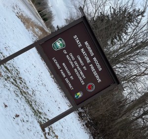Morris woods preserve sign surrounded by snow