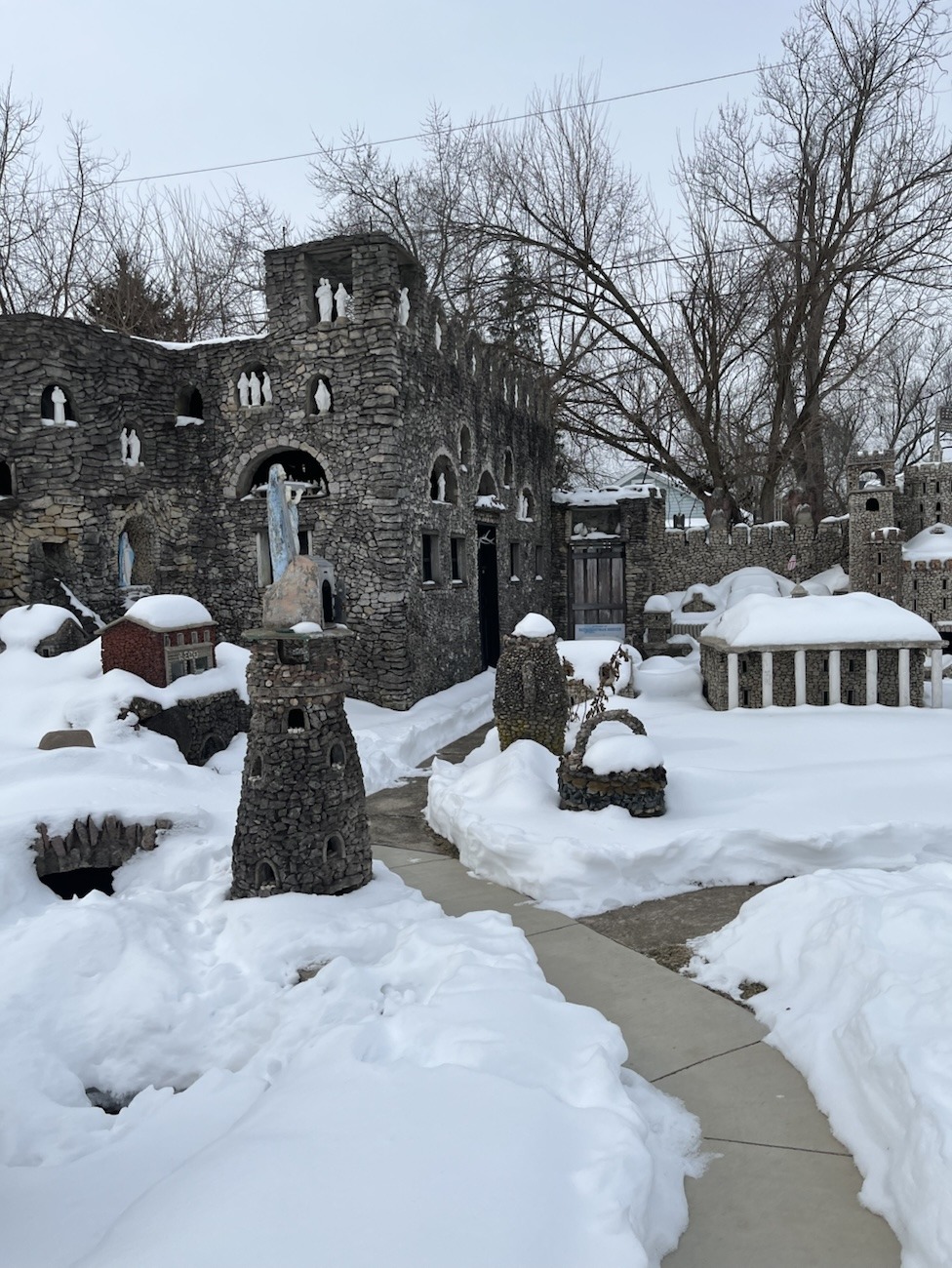 rock art from the great depression era forms a school house covered in snow