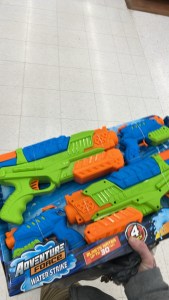 Blue orange and green multicolored squirt guns