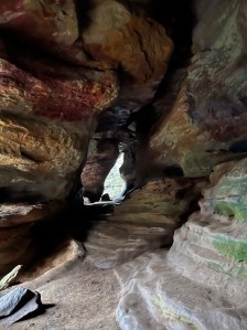 Layers of red and orange sandstone inside cave